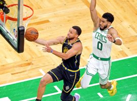 Jayson Tatum of the Boston Celtics tries to catch up to Steph Curry from the Golden State Warriors in Game 4 of the 2022 NBA Finals at TD Garden. (Image: Getty)