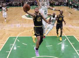Steph Curry from the Golden State Warriors has a wide-open layup against Jayson Tatum and the Boston Celtics in Game 4 of the NBA Finals. (Image: Getty)