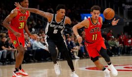 Dejounte Murray from the San Antonio Spurs tips the ball away from Trae Young of the Atlanta Hawks, but now the two adversaries will become teammates after a huge trade. (Image: USA Today Sports)