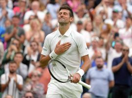 Novak Djokovic started slow, but managed to win his first-round match at Wimbledon in four sets. (Image: Kirsty Wigglesworth/AP)