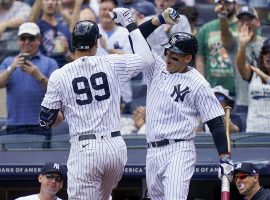 Anthony Rizzo from the New York Yankees congratulates Aaron Judge (99) after he hit his 21 st home run of the season. (Image: Getty)