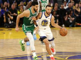 Jayson Tatum from the Boston Celtics defends Steph Curry of the Golden State Warriors in transition of Game 1 of the 2022 NBA Finals. (Image: Porter Lambert/Getty)