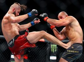 Jiri Prochazka outlasted Glover Teixeira, landing a submission in the final minute of the fifth round to claim the light heavyweight title at UFC 275. (Image: Yong Teck Lim/Getty)