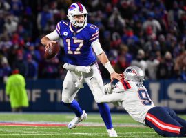 Josh Allen from the Buffalo Bills stiff arms Deatrich Wise of the New England Patriots in Week 13 last season. (Image: Getty)