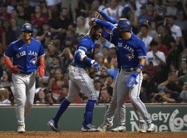 The Toronto Blue Jays congratulate Raimel Tapia on an inside the park grand slam against the Boston Red Sox at Fenway Park. (Image: Bob DeChiara/USA Today Sports)