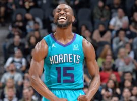 Kemba Walker flexes after hitting a 3-point shot during a game with the Charlotte Hornets in 2018. (Image: Getty)