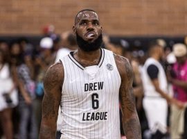 LeBron James at the free throw line for the MMV Cheaters in the Drew League in Los Angeles. (Image: Getty)
