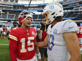 Patrick Mahomes from the Kansas City Chiefs chats up Justin Herbert of the LA Chargers after an AFC West division game during Hebert’s rookie season. (Image: Getty)