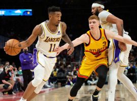 Malik Monk from the LA Lakers drives against Kevin Huerter of the Atlanta Hawks last season, but the two will be teammates next season with the Sacramento Kings. (Image: Getty)