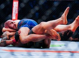 Brian Ortega (top) nearly submitted Alexander Volkanovski (bottom) in a title fight last year. Now, Ortega will face Yair Rodriguez with another potential title shot on the line. (Image: Alex Bierens de Haan/Getty)