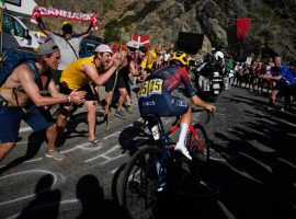 Rowdy fans cheer on Tom Pidcock during his remarkable win at Alpe d’Huez in Stage 12 of the Tour de France. (Image: Daniel Cole/AP)