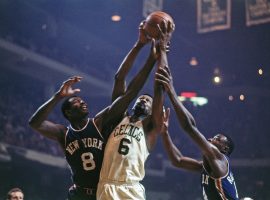 NBA Hall of Famer Bill Russell hauls down a rebound against Walt Bellamy of the New York Knicks in 1967. (Image: Getty)