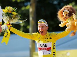 Tadej Pogacar from UAE Team Emirates celebrates his back-to-back victories in the Tour de France last year in Paris. (Image: Stephane Mahe/Reuters)