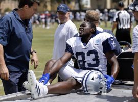 Dallas Cowboys wide receiver James Washington clutches his fractured foot after an unfortunate injury in training camp on Monday. (Image: Getty)