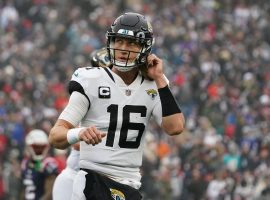 A dejected Trevor Lawrence from the Jacksonville Jaguars heads off the field after throwing an interception. (Image: Getty)